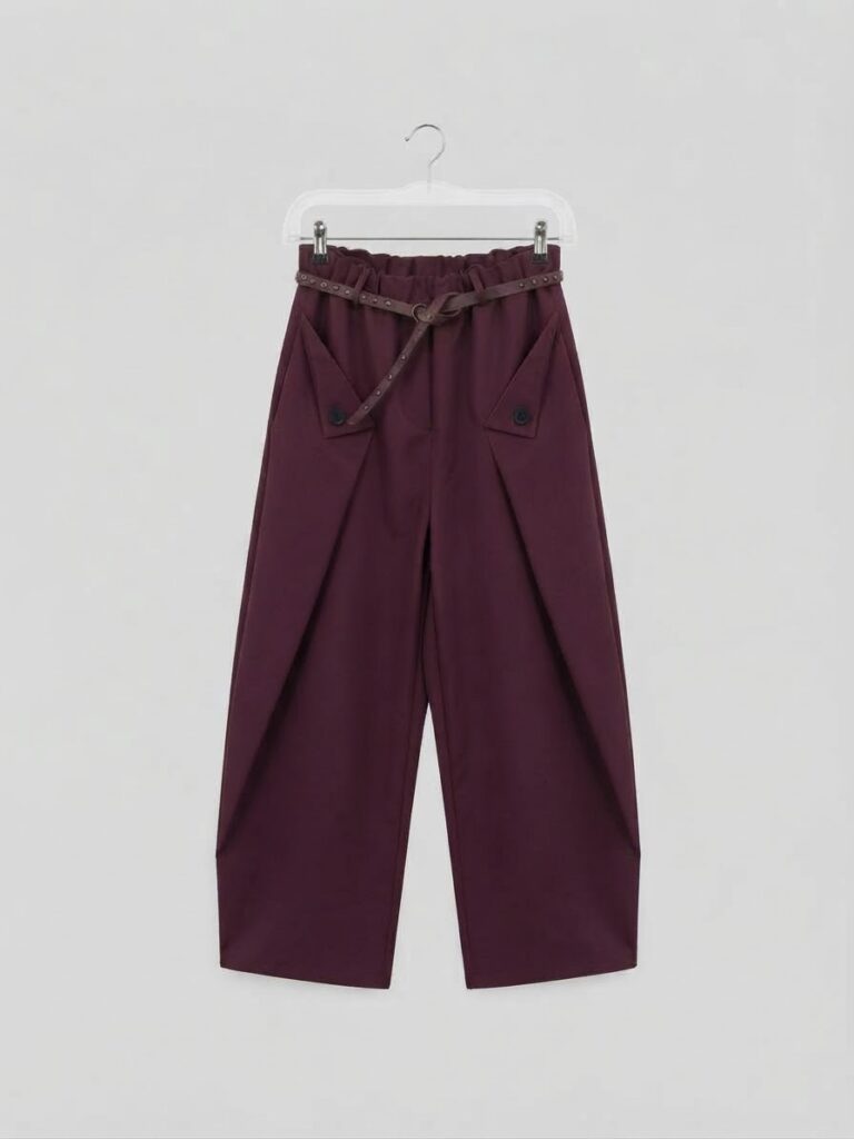 Pantalone a palloncino con pieghe e cintura borchiata
